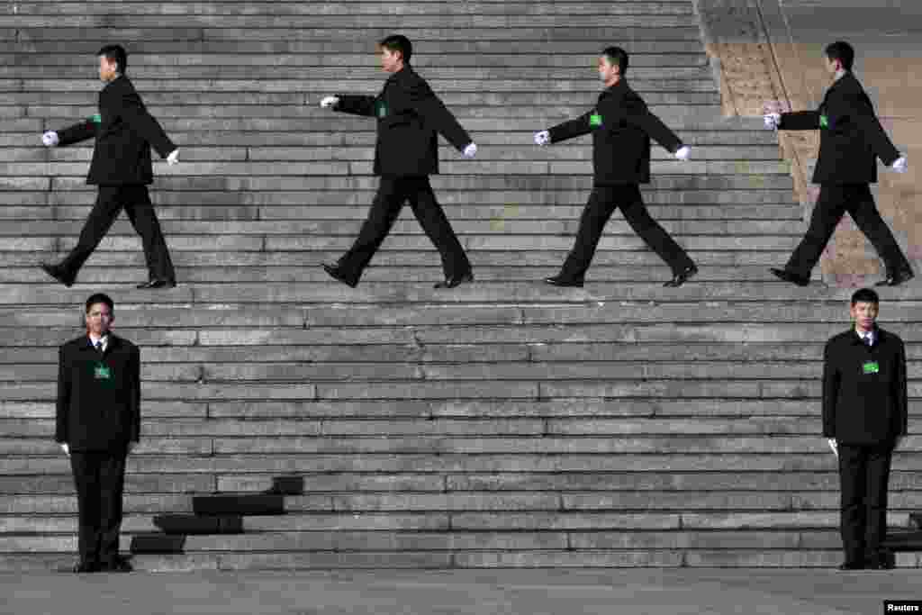 Chinese security personnel march outside the Great Hall of the People in Beijing. In a rare move, China on Monday declined to reveal its defense budget request for 2013. 