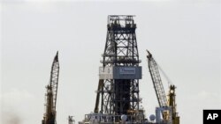 The Transocean Development Driller III is seen on the surface above the Deepwater Horizon oil wellhead on the Gulf of Mexico near the coast of Louisiana, 16 Jul 2010