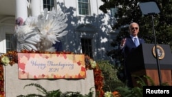 (FILE) U.S. President Joe Biden pardons the National Thanksgiving Turkey on the South Lawn at the White House in Washington, U.S., November 25, 2024.