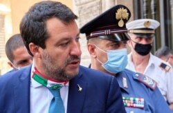 FILE - Former Interior Minister Matteo Salvini leaves the Senate prior to a vote on lifting his immunity for a trial on the August 2019 Open Arms case, in Rome, July 30, 2020.
