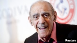 FILE - Actor Abe Vigoda smiles as he attends the Friars Club Roast of Betty White in New York, May 16, 2012. 