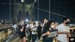 Protesters arrive at the Brooklyn Bridge after a march from the Barclays Center in New York, Aug. 21, 2020. Grieving families organized the "March for the Dead" to mourn American losses during the coronavirus pandemic. (John Nacion/STAR MAX)