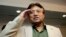 FILE - Former Pakistani President Pervez Musharraf salutes his party members during a ceremony to celebrate Pakistan National Day ahead his trip to Karachi, in Dubai, United Arab Emirates, Saturday, March 23, 2013. Musharraf says he will follow through with his 