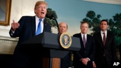 President Donald Trump speaks before signing a presidential memorandum on the imposition of tariffs and investment restrictions on China, in the Diplomatic Reception Room of the White House, March 22, 2018, in Washington.