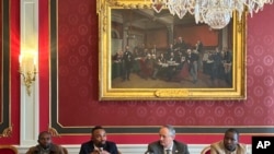 FILE–The envoys of armed groups pledge that their forces will work to end sexual violence, food insecurity and conditions of famine, and to ensure greater access to health care in eastern Congo in areas they control in Geneva, Switzerland, March 26, 2024.