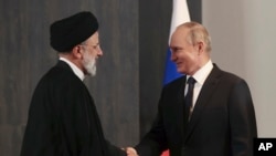 ولادیمیر پوتین و ابراهیم رئیسی، روسای جمهوری روسیه و ایران