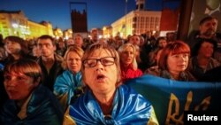 People attend a rally against approval of the so-called Steinmeier Formula, in Kyiv, Ukraine, Oct. 2, 2019. 