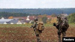 FILE - Soldiers take part in an exercise of the U.S. Army's Global Swift Response 17 Media Day near Hohenfels, Germany, Oct. 9, 2017.