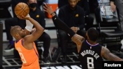 Jun 30, 2021; Los Angeles, California, USA; Phoenix Suns guard Chris Paul (3) shoots against Los Angeles Clippers forward Marcus Morris Sr. (8)during the second half in game six of the Western Conference Finals for the 2021 NBA Playoffs at Staples Center.