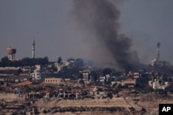 Smoke rises from a fire in southern Lebanon as seen from northern Israel, Oct. 5, 2024.