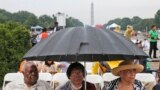 Stanley Samuels, Rita Samuels and Sammie Whiting-Ellis wait for the anniversary program to begin as they attend the March on Washington, in front of the Lincoln Memorial in Washington, August 28, 2013.