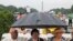 Stanley Samuels, Rita Samuels and Sammie Whiting-Ellis wait for the anniversary program to begin as they attend the March on Washington, in front of the Lincoln Memorial in Washington, August 28, 2013.