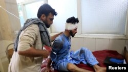  An injured man receives a treatment at the hospital, after a suicide attack in Jalalabad, Afghanistan, June 13, 2019.