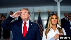 Дональд Трамп и Мелания Трамп посетили Гран-при Freedom 250 в Вашингтоне 23 августа 2026 года (Фото: Doug Mills/Pool via REUTERS)