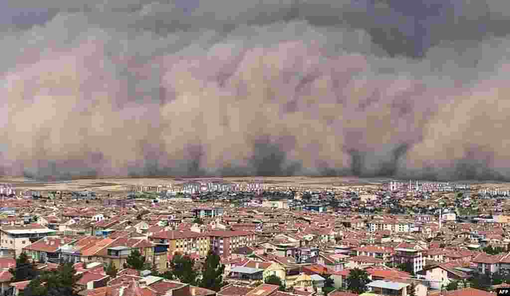 A handout TV grab made available by the Demiroren News Agency (DHA) shows a sandstorm sweeping over Polatli, in Ankara,Turkey, Sept. 12, 2020.
