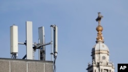 Mobile network phone masts are visible in front of St Paul's Cathedral in the City of London, Jan. 28, 2020.