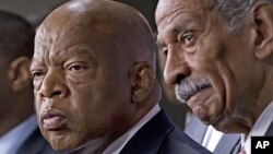 Rep. John Lewis, D-Ga., left, and Rep. John Conyers, D-Mich., right, co-chairs of the Civil Rights Taskforce of the Congressional Black Caucus, join other members of the House to express disappointment in the Supreme Court's decision on Shelby County v. H