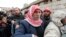 Syrians, fleeing the violence from the Syrian town of Qara, queue to register to get help from relief agencies at the Lebanese border town of Arsal, in the eastern Bekaa Valley, Nov. 18, 2013. 