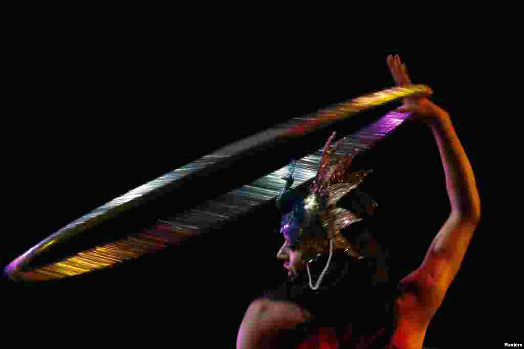 Burlesque dancer Karis Wilde performs with a hoop during the Lucha VaVoom &quot;Night of the Vampire&quot; performance in Los Angeles, California. 