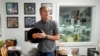 Mark Michaels, CEO and chairman of United Record Pressing, holds a vinyl record in his office July 11, 2024, in Nashville, Tenn. 