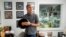 Mark Michaels, CEO and chairman of United Record Pressing, holds a vinyl record in his office July 11, 2024, in Nashville, Tenn. 