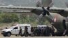 FILE - A coffin containing the body of one of the victims of a military helicopter crash in Poso, Central Sulawesi, is loaded into a cargo plane to be transported to Jakarta at the airport in the provincial capital of Palu, Indonesia, March 21, 2016.