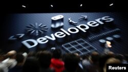 FILE - Apple Chief Executive Officer Tim Cook speaks at the Apple Worldwide Developer conference (WWDC) in San Jose, California, U.S., June 4, 2018. 