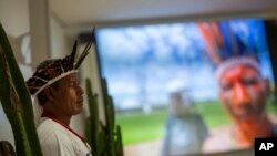 A Pataxo indigenous man attends the launch of the report on violence against indigenous peoples in Brazil, at the headquarters of the National Conference of Bishops in Brasilia, Brazil, Sept. 24, 2019. 