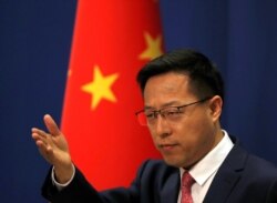 Chinese Foreign Ministry spokesman Zhao Lijian attends a news conference in Beijing, April 8, 2020.