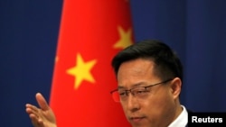 FILE - Chinese Foreign Ministry spokesman Zhao Lijian attends a news conference in Beijing, April 8, 2020.