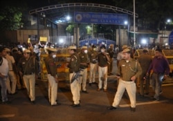 Policemen stand guard at the entrance of Tihar central prison where four men were hanged in New Delhi, India, March 20, 2020.