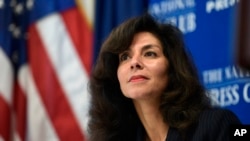 Ashley Tabaddor, a federal immigration judge in Los Angeles who serves as the president of the National Association of Immigration Judges, listens as she is introduced to speak at the National Press Club​ in Washington, Sept. 21, 2018, on the pressures on judges and the federal immigration court system.