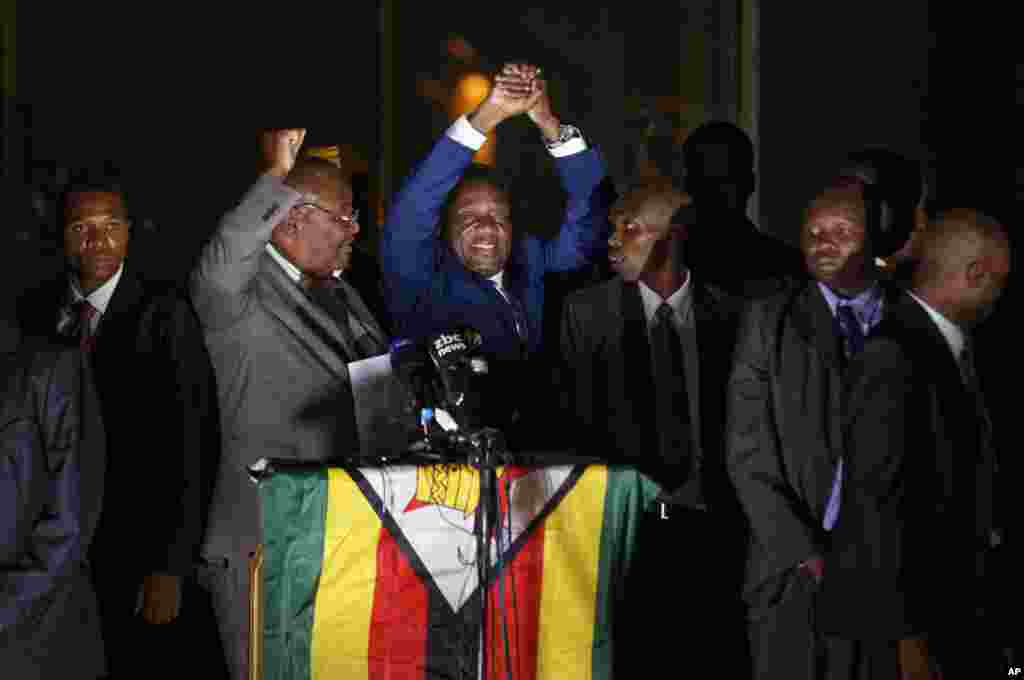 Zimbabwe&#39;s President in waiting Emmerson Mnangagwa greets supporters gathered outside the Zanu-PF party headquarters in Harare.
