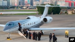 U.S. Under Secretary of State Keith Krach, center, gestures after disembarking from a plane upon arrival at the air force base airport in Taipei, Taiwan on Thursday, Sept. 17, 2020. Krach is in Taiwan on Thursday for the second visit by a high-level…