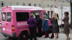 Customers line up at the Curbside Cupcakes truck in Washington