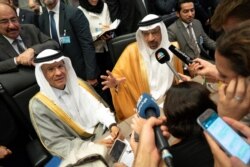 FILE - In this photo taken July 01, 2019, Saudi Arabia's Energy Minister Khaled al-Falih (R) and Saudi Deputy Oil Minister Prince Abdulaziz bin Salman bin Abdulaziz talk to the press on the sidelines of an oil meeting in Vienna, Austria.