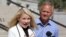 Elizabeth Smart speaks during a news conference while her father, Ed Smart, looks on in Salt Lake City, Sept. 13, 2018. 