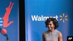 First lady Michelle Obama arrives for a Wal-Mart announcement of a comprehensive effort to provide healthier and more affordable food choices to their customers, Jan. 20, 2011, in Washington.