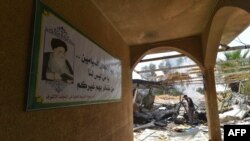 دیمەنی وێرانەی دوای هێرشەکان بۆ سەر حەشدی شەعبی لە شارۆچکەی بەرتەلە لە دەشتی نەینەوا.  