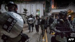 Police arrest a protester in the Wanchai area of Hong Kong, Oct. 1, 2019.