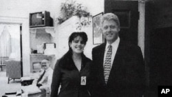 FILE - Official White House photo from page 3179 of Independent Counsel Kenneth Starr's report on President Clinton, showing the president and Monica Lewinsky at the White House, taken Nov. 17, 1995.