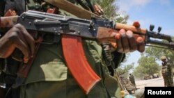 A fighter stands guard in southern Somali port city of Kismayo, (File photo).