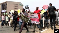 People protest at the secretariat of the Nigerian Bar Association following the suspension of Nigeria's Chief Justice Walter Onnoghen, in Abuja, Nigeria, Jan. 28, 2019. 