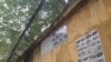 Informal lenders advertise by writing their numbers on Vietnamese walls and street lamps. (H. Nguyen/VOA)