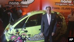 Tata Motors Chairman Ratan Tata poses with a Tata Nano car during Tata Motors-Flag-in ceremony of Nano in Mumbai, India, 28 Jun 2010