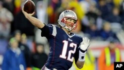 New England Patriots quarterback Tom Brady (12) throws during the first half of the NFL football AFC Championship.