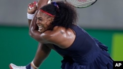 Serena Williams of the United States returns to Elina Svitolina of Ukraine at the 2016 Summer Olympics in Rio de Janeiro, Brazil, Aug. 9, 2016.