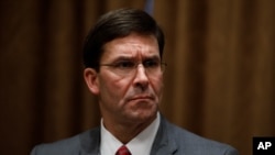 FILE - In this Oct. 7, 2019, file photo, Defense Secretary Mark Esper participates in a briefing with President Donald Trump and senior military leaders in the Cabinet Room at the White House in Washington. Esper declared on Monday, Nov. 25 that…