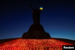 1,000 candles are seen in front of the 'Motherland' monument during a commemorative ceremony on the 1000th day of Russia's full scale attack on Ukraine, in Kyiv, Ukraine, Nov. 19, 2024.