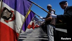 Members of veterans associations attend a ceremony to commemorate the 73rd anniversary of the Oradour-sur-Glane massacre in the French martyr village of Oradour-sur-Glane, France June 10, 2017.